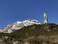 Majestic Golden Eagle Monument at the Simplon Pass with Snow-Capped Alpine Peaks in the Background, Valais Royalty Free Stock Photo