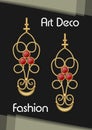 Golden earrings in art deco style with ruby pendant. Red gem on antiquarian pendant