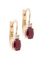 Golden earrings with diamonds and ruby, isolated on the white Royalty Free Stock Photo