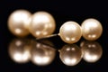 Golden earstuds with white pearls in it Royalty Free Stock Photo