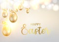 Golden Easter eggs with calligraphic text over blurred bokeh and gray background. Royalty Free Stock Photo