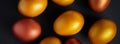 Golden Easter eggs close-up on a black background. Luxurious festive decor. Banner format Royalty Free Stock Photo