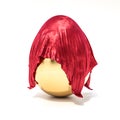 Golden egg covered with a red satin cloth