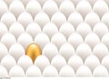 Golden egg standing out from the others Royalty Free Stock Photo