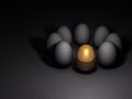 A golden egg that stands out in particular. Future possibilities and promising options. Many eggs lined up in a ring. Royalty Free Stock Photo