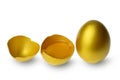 Golden eggs and half broken egg with yolk isolated at white background Royalty Free Stock Photo