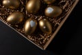 Golden eggs in paper box on a table. Top view