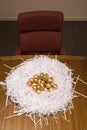 Golden eggs in a paper nest