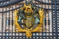 Golden emblem of the United Kingdom on the entrance gate at Buckingham Palace Royalty Free Stock Photo