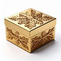 Golden Embossed Snowflake Patterned Box on White Surface Royalty Free Stock Photo