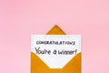 Golden envelope with award card Congratulations You are a winner. Overhead view