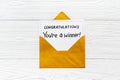 Golden envelope with award card Congratulations You are a winner. Overhead view