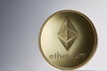 Golden ethereum coin. Crypto currency blockchain coin ethereum symbol on light background.