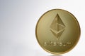 Golden ethereum coin. Crypto currency blockchain coin ethereum symbol on light background.