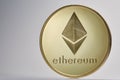 Golden ethereum coin. Crypto currency blockchain coin ethereum symbol on light background.
