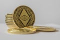 Golden Etherium coin close up on white background.