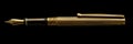 Golden exquisite gold fountain pen on black background, expensive fountain ink pen, banner Royalty Free Stock Photo