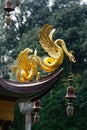 Golden fantasy animal decoration of a chinese style pagoda Royalty Free Stock Photo