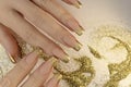Golden fashionable French manicure on long nails