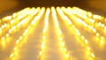 Golden festive background. Defocused yellow holiday lights in perspective as a concept of speed
