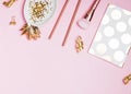 Golden festive decor and feminine accessories on the pink background Royalty Free Stock Photo
