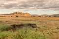 Golden fields, vintage wagon wheel, thunder rain clouds Royalty Free Stock Photo