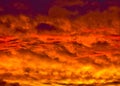 Golden Fiery Sunset with layered Clouds Royalty Free Stock Photo