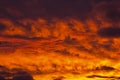 Golden Fiery Sunset with layered Clouds