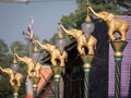 Golden Fighting Elephants Statue on Top of The Pillar in The Purple Town