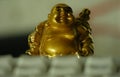 Golden figurine behind the keyboard