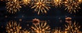 Golden fireworks bloom high above a dark tranquil pond, mirrored flawlessly in the water below Royalty Free Stock Photo