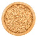Golden flax seeds in wooden bowl isolated.