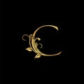 Golden floral letter C logo Icon, Luxury alphabet font initial vector design isolated on black background Royalty Free Stock Photo