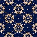 Golden floral seamless design on blue background