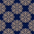 Golden floral seamless pattern on blue background Royalty Free Stock Photo