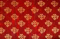 Golden flower native pattern on red background. Royalty Free Stock Photo