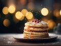 Golden Fluffy pancakes folded with powdered sugar icing on a plate, lights blurred bokeh background