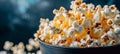 Golden fluffy popcorn close up freshly popped kernels revealing white interiors on dark background Royalty Free Stock Photo