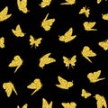 Golden flying butterflies on a black background. Seamless digital scrapbooking paper. Seamless pattern for fabrics