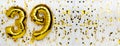 Golden foil balloon number, figure thirty-nine on white with confetti background. 39th birthday card. Anniversary Royalty Free Stock Photo