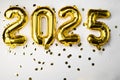 golden foil balloon number 2025. New Year two thousand twenty fifth and golden numbers. 20 and 25 on a gray concrete
