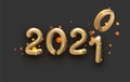 Golden foil 2021 balloon sign on black background