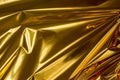 Golden folded metallic foil abstract bacgkground