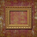 Golden frame on burgundy grunge wallpaper Royalty Free Stock Photo