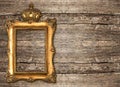 Golden frame with crown over wooden background Royalty Free Stock Photo