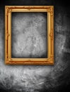 Golden frame on grunge wall Royalty Free Stock Photo