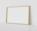 Golden frame leaning on white floor in interior mockup. Template of a picture framed on a wall 3D rendering Royalty Free Stock Photo