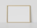 Golden frame leaning on white floor in interior mockup. Template of a picture framed on a wall 3D rendering Royalty Free Stock Photo