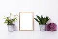 Golden frame mock-up on white wall Royalty Free Stock Photo