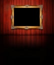 Golden frame on red wall